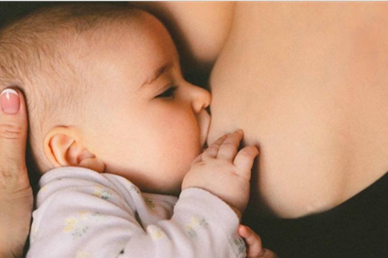 Mother breastfeeding baby