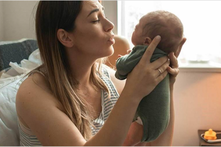 Mother soothing her newborn baby