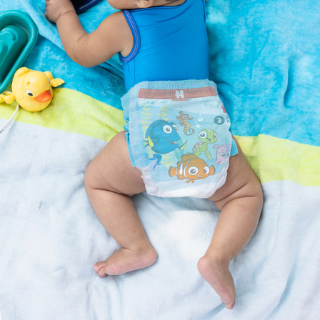 Baby wearing Huggies® Little Swimmers® Disposable Swim Pants made for swimming