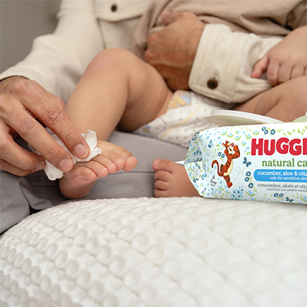 Image of parent using Huggies® Natural Care® Cucumber, Aloe & Vitamin E Baby Wipes on baby’s foot
