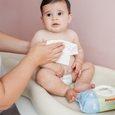 Baby cleaned with Huggies® Natural Care® Extra Sensitive Baby Wipes formulated for sensitive skin