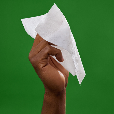 Huggies® Extra Large Baby Wipes being held by hand. They are safe for sensitive skin